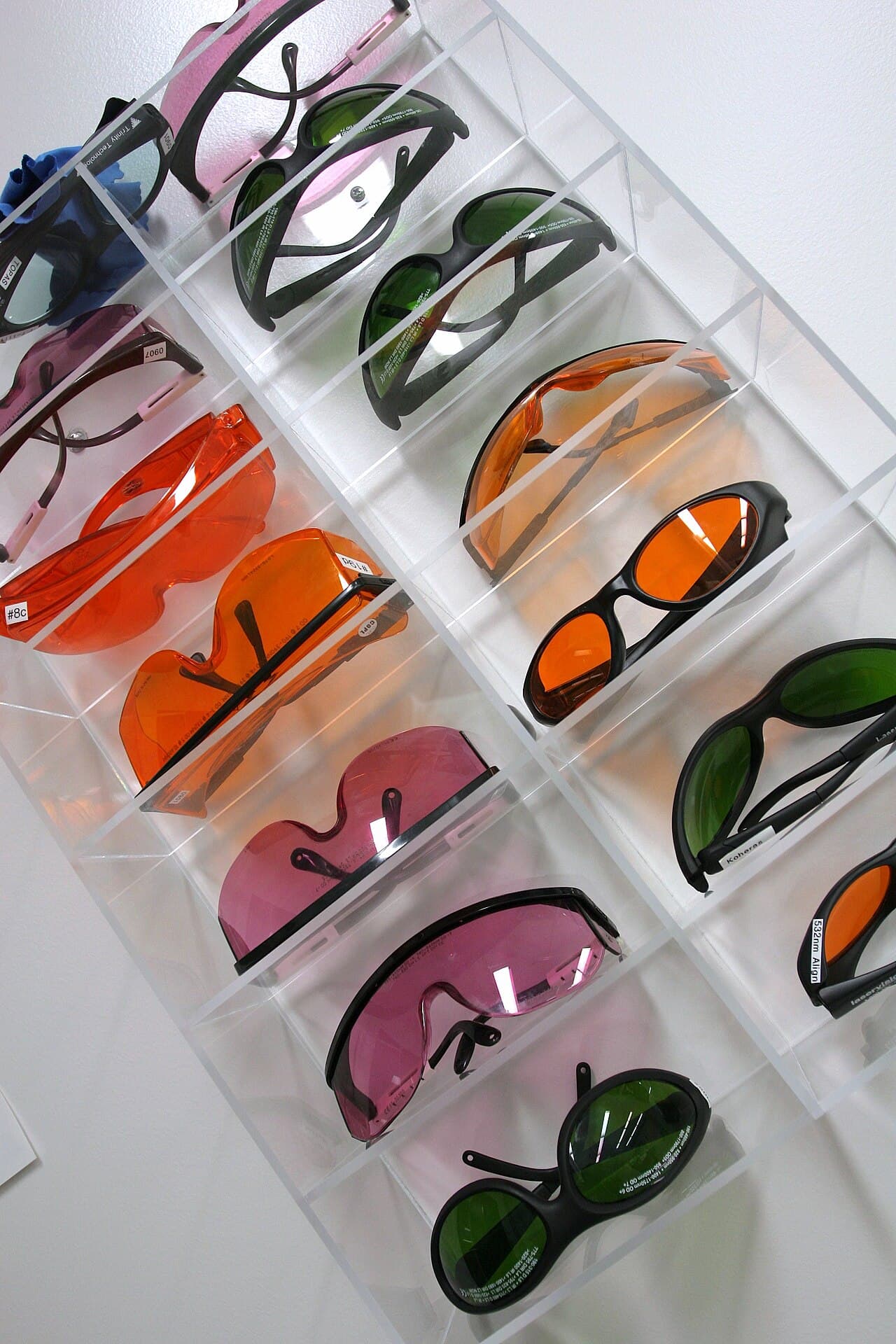 Laboratory safety goggles on a rack